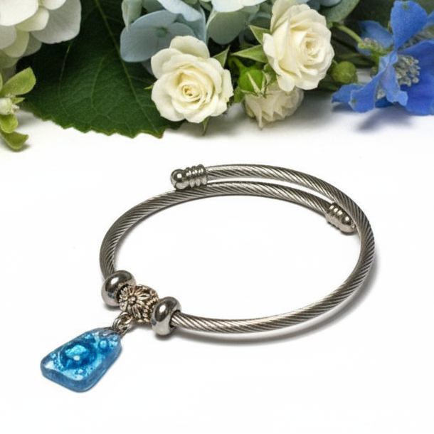 Turquoise with bubbles Stainless Steel Bracelet Glass Charm Bead. Easy to put on adjustable stretch memory wire. One size fits most