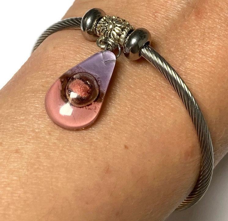 Pink, Copper and Brown Stainless Steel Bracelet Glass Charm Bead. Easy to put on adjustable stretch memory wire. One size fits most