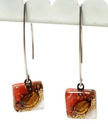 Open oval wire with handmade in red, soft lavender and brown recycled glass beads.
