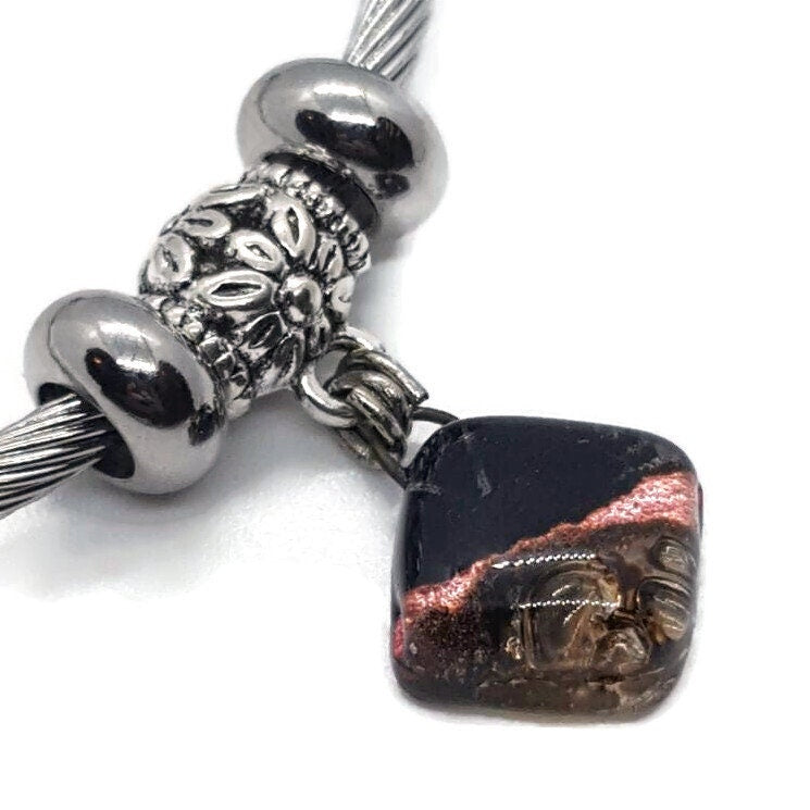 Black, Copper and Brown Stainless Steel Bracelet Glass Charm Bead. Easy to put on adjustable stretch memory wire. One size fits most