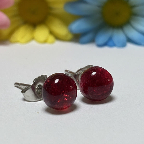 Transparent cerise Glass studs