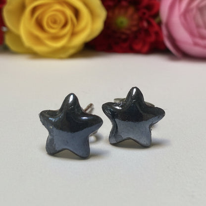 Handcrafted black star recycled glass stud earrings with hypoallergenic stainless steel posts by Recycled Glass Studio.