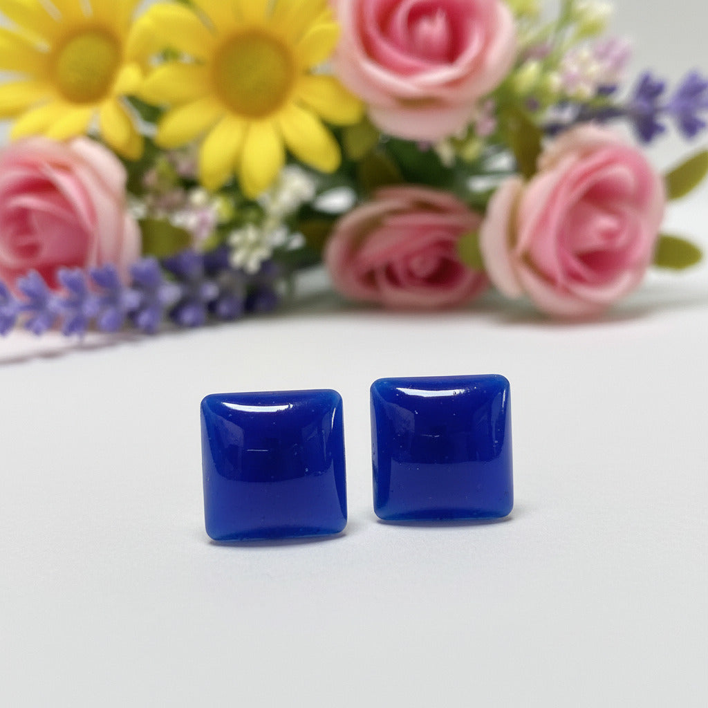 Pair of handmade 8mm square geometric stud earrings made from vibrant cobalt blue recycled glass pearlized tiles with hypoallergenic stainless steel posts.