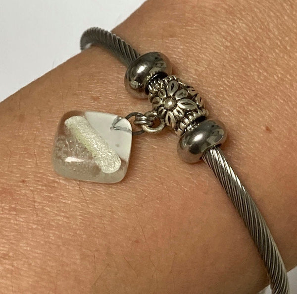 White Stainless Steel Bracelet Glass Charm Bead. Easy to put on adjustable stretch memory wire. One size fits most