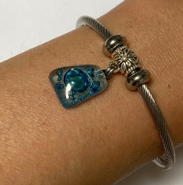 Turquoise with bubbles Stainless Steel Bracelet Glass Charm Bead. Easy to put on adjustable stretch memory wire. One size fits most