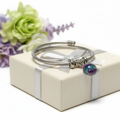Purple and green Stainless Steel Bracelet Glass Charm Bead. Easy to put on adjustable stretch memory wire. One size fits most