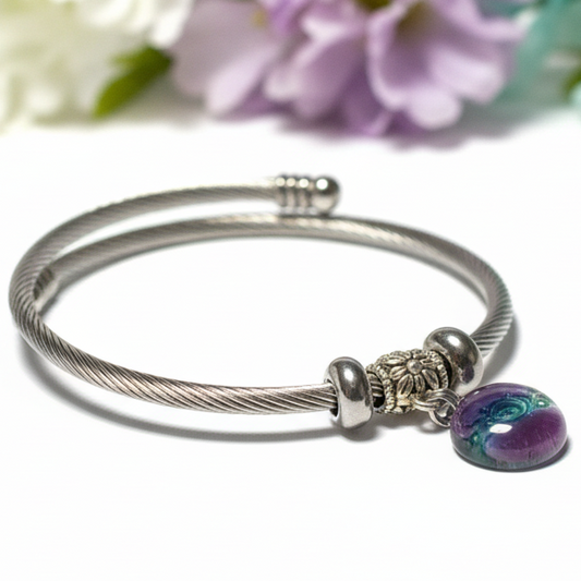 Purple and green Stainless Steel Bracelet Glass Charm Bead. Easy to put on adjustable stretch memory wire. One size fits most