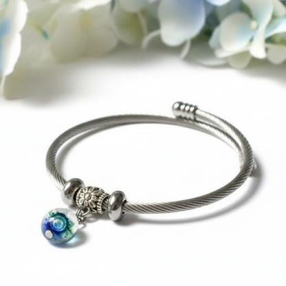 Dark Blue, Green and White Stainless Steel Bracelet Glass Charm Bead. Easy to put on adjustable stretch memory wire. One size fits most