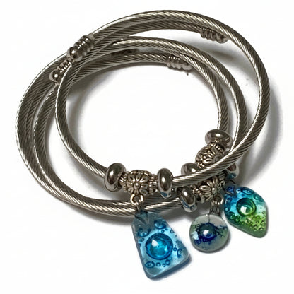 Dark Blue, Green and White Stainless Steel Bracelet Glass Charm Bead. Easy to put on adjustable stretch memory wire. One size fits most