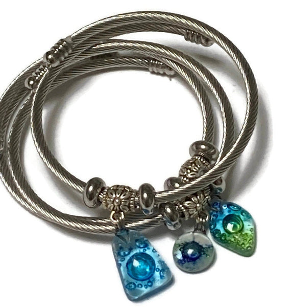 Dark Blue, Green and White Stainless Steel Bracelet Glass Charm Bead. Easy to put on adjustable stretch memory wire. One size fits most