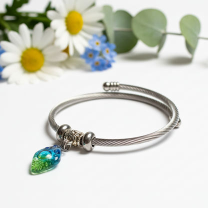 Turquoise, green and blue Stainless Steel Bracelet Glass Charm Bead. Easy to put on adjustable stretch memory wire. One size fits most.