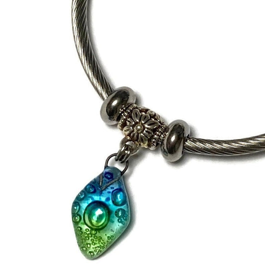 Turquoise, green and blue Stainless Steel Bracelet Glass Charm Bead. Easy to put on adjustable stretch memory wire. One size fits most.