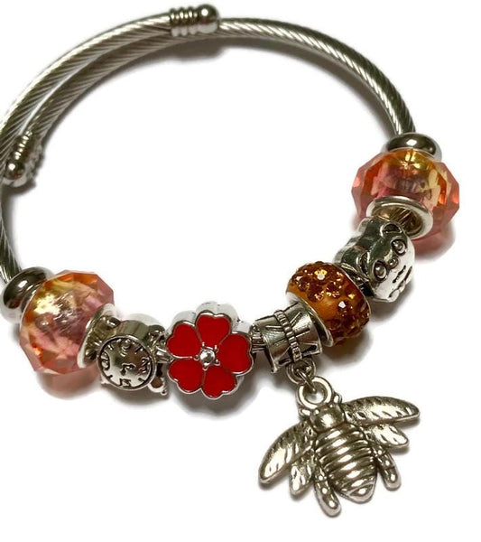 Pink, red and orange. Stainless Expandable Easy to put on stretch memory wire Charm Bracelet. One size fits most