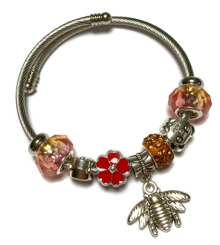 Pink, red and orange. Stainless Expandable Easy to put on stretch memory wire Charm Bracelet. One size fits most