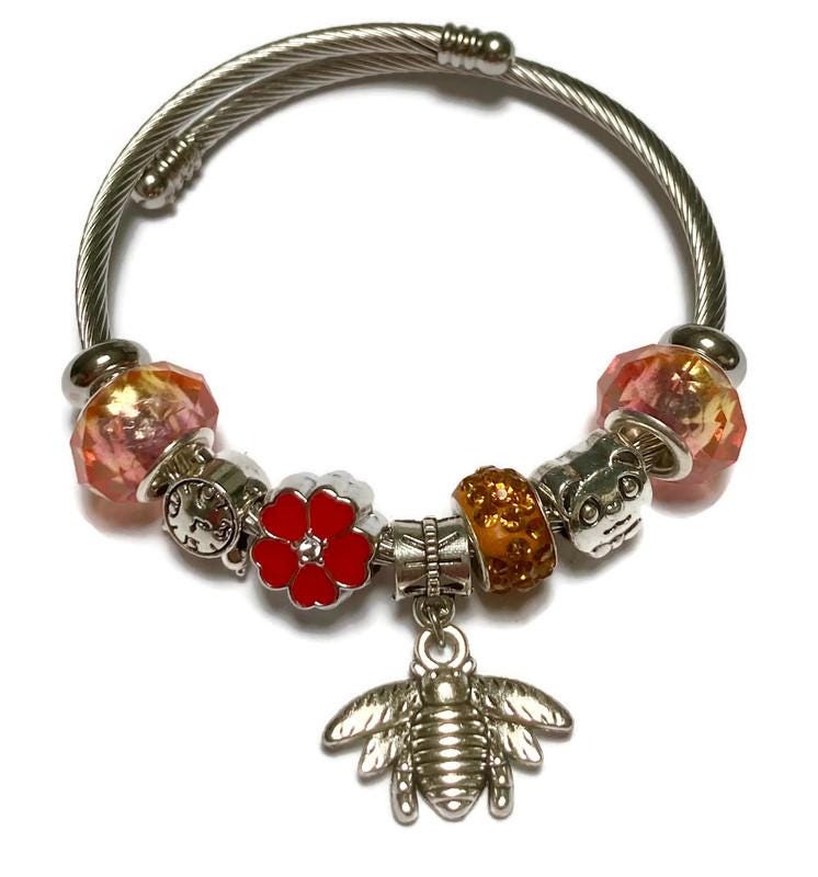 Pink, red and orange. Stainless Expandable Easy to put on stretch memory wire Charm Bracelet. One size fits most