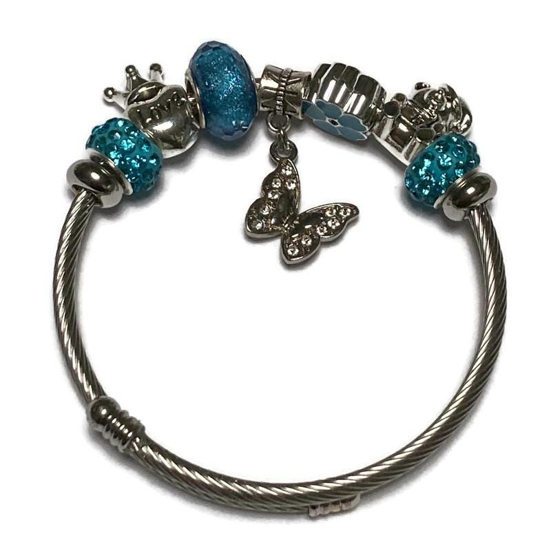 Butterfly. Blue Stainless Expandable Easy to put on stretch memory wire Charm Bracelet. One size fits most