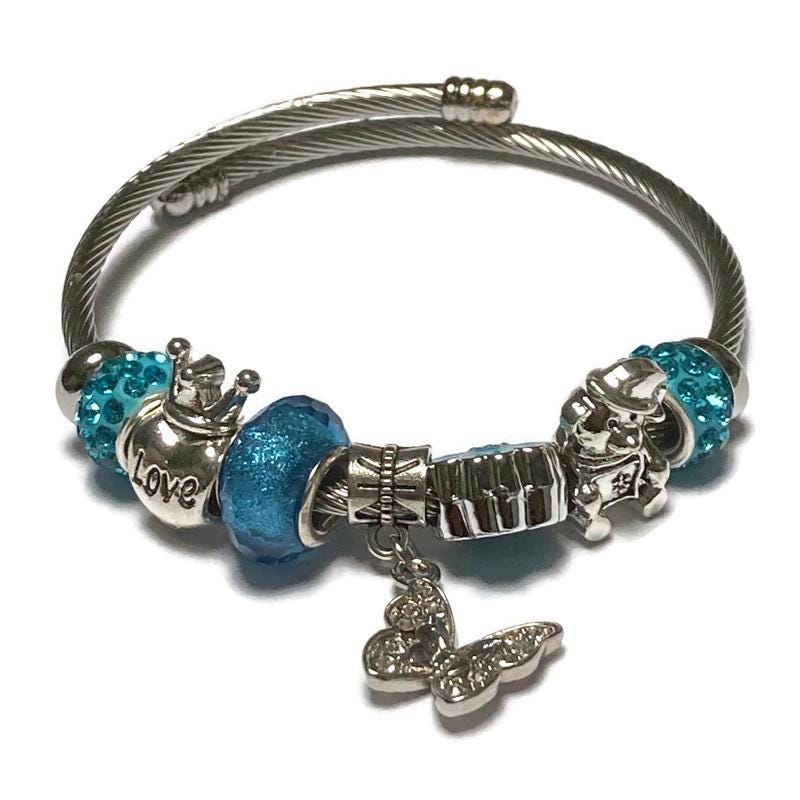 Butterfly. Blue Stainless Expandable Easy to put on stretch memory wire Charm Bracelet. One size fits most