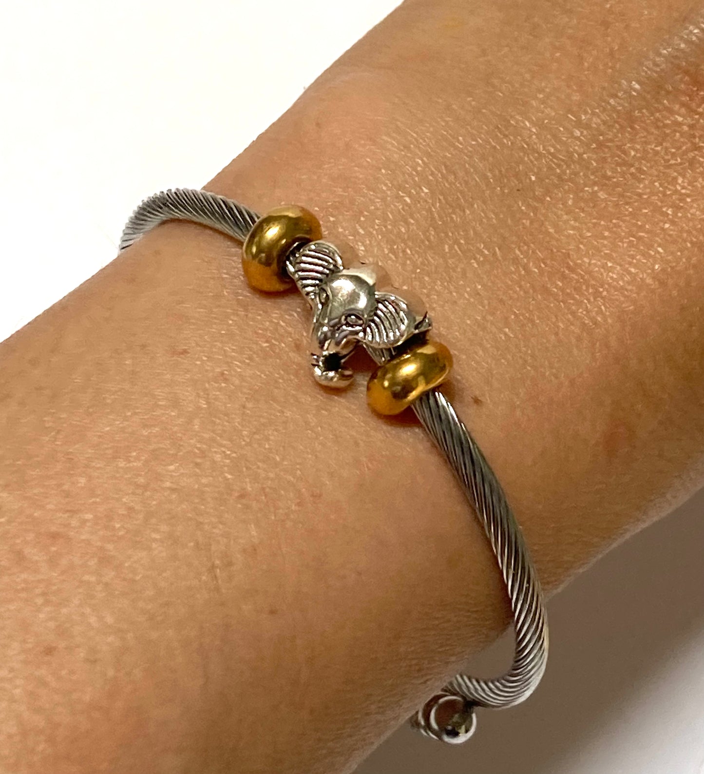 Elephant Stainless Steel Bracelet Glass Charm Bead. Easy to put on adjustable stretch memory wire. One size fits most