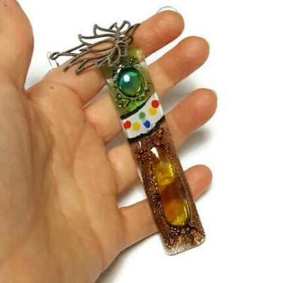 Brown and green fused glass lotus flower ornament.