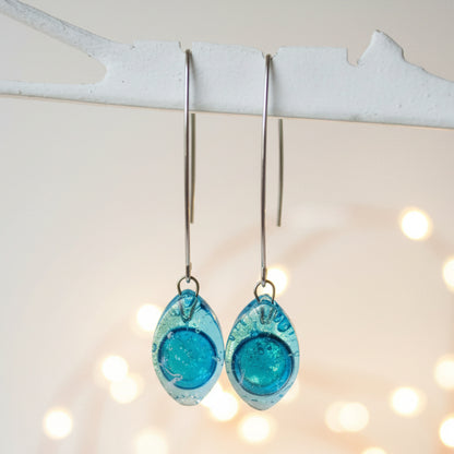 Long open oval V drop earrings. Blue recycled glass drop dangles.