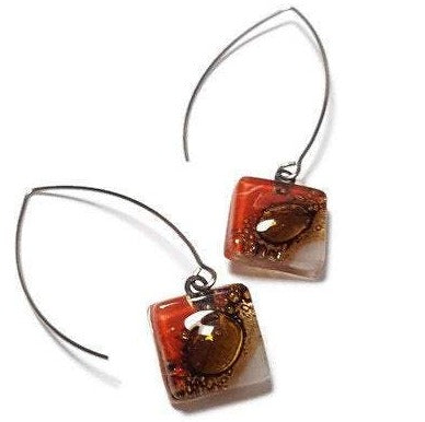 Open oval wire with handmade in red, soft lavender and brown recycled glass beads.