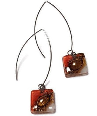 Open oval wire with handmade in red, soft lavender and brown recycled glass beads.