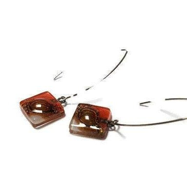 Open oval wire with handmade in red, soft lavender and brown recycled glass beads.