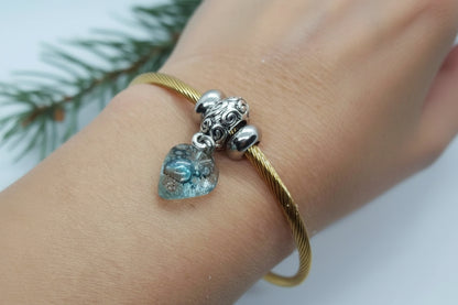Aqua Blue Twisted Stainless Steel Bracelet Glass Charm Bead. Easy to put on expandable memory wire cuff. One size fits most