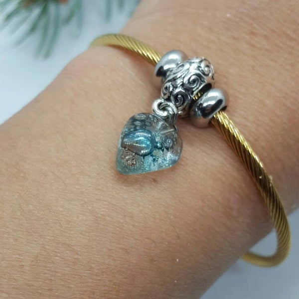Aqua Blue Twisted Stainless Steel Bracelet Glass Charm Bead. Easy to put on expandable memory wire cuff. One size fits most