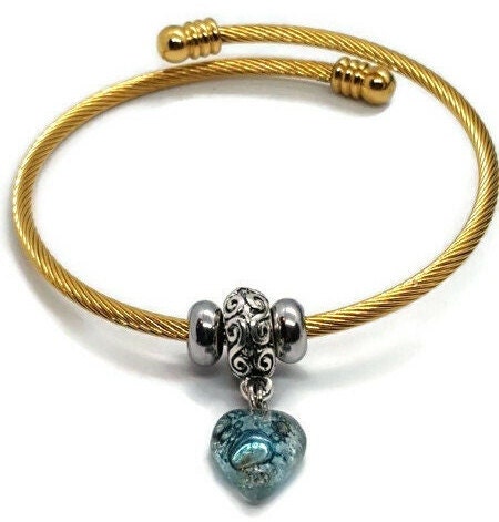 Aqua Blue Twisted Stainless Steel Bracelet Glass Charm Bead. Easy to put on expandable memory wire cuff. One size fits most