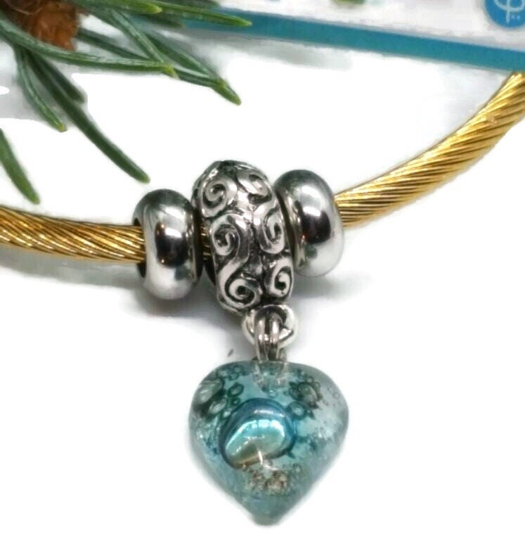 Aqua Blue Twisted Stainless Steel Bracelet Glass Charm Bead. Easy to put on expandable memory wire cuff. One size fits most