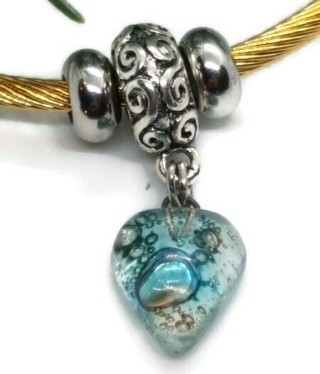 Aqua Blue Twisted Stainless Steel Bracelet Glass Charm Bead. Easy to put on expandable memory wire cuff. One size fits most